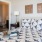 a bedroom with a bed and a lamp