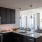 a kitchen with black cabinets