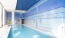 a swimming pool with a blue wall