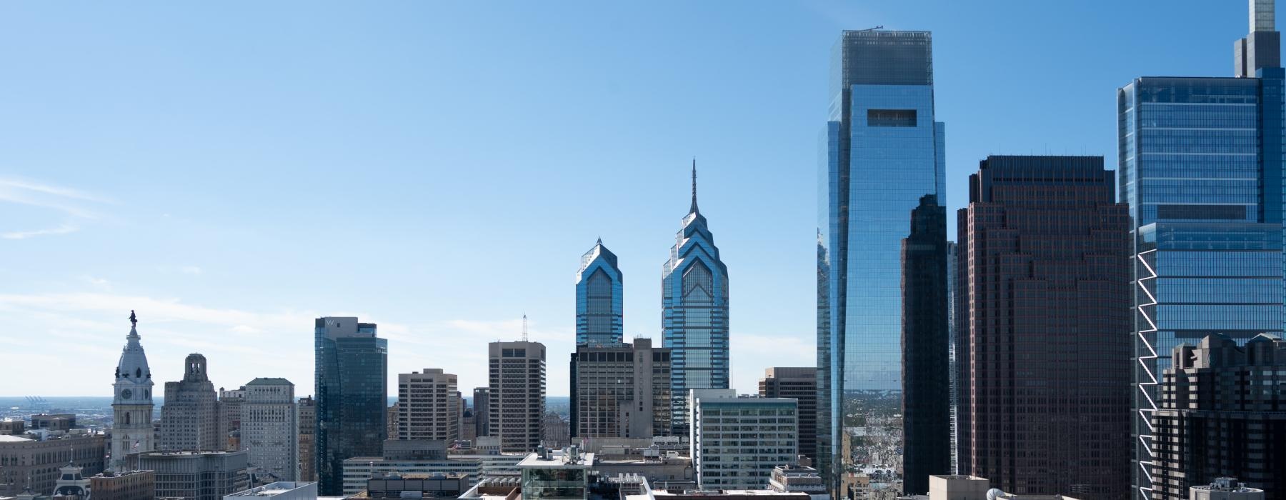 a city skyline with blue sky