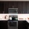 a kitchen with black cabinets