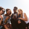 group of friends looking at phones