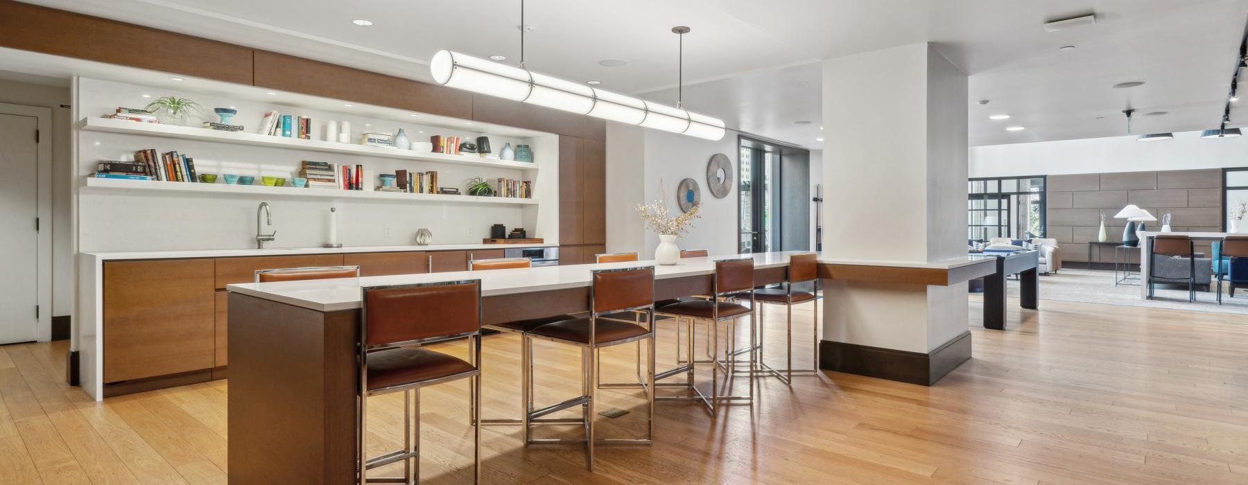 a large kitchen with a wood floor